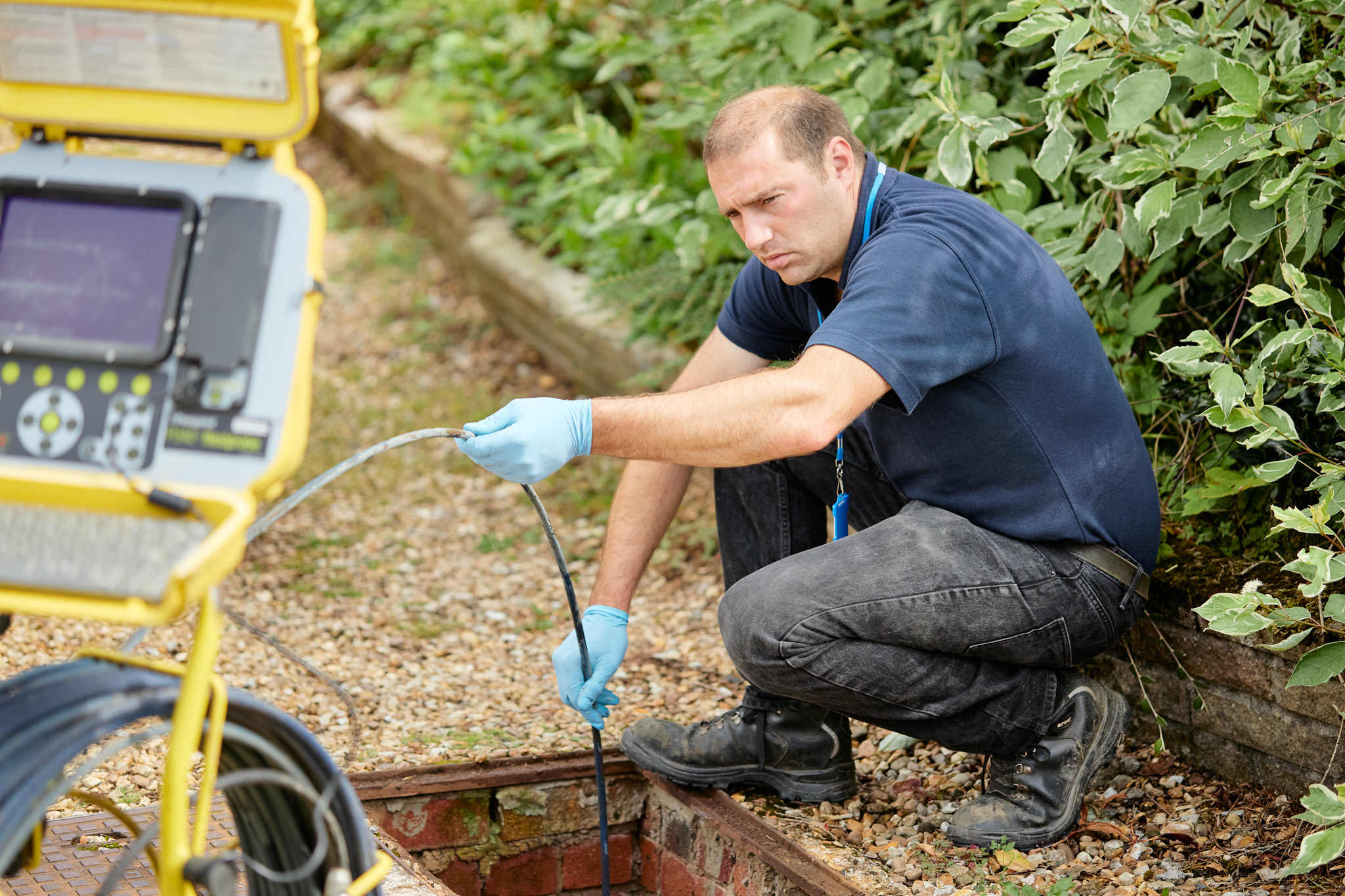 UKDP team member onsite drainage inspection with camera