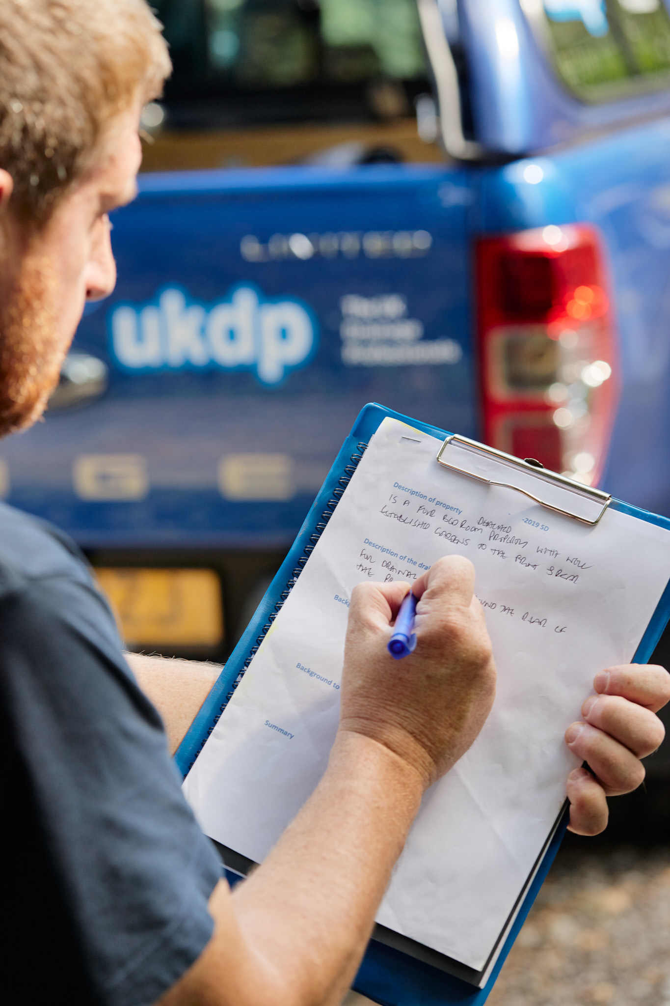 UKDP team member onsite filling in form